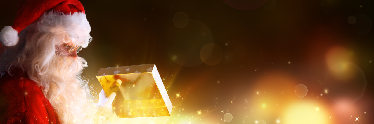 My Son With Canavan Disease Showed Me You're Not Too Old to See Santa Santa Claus Opening Christmas Present With Shiny Stars