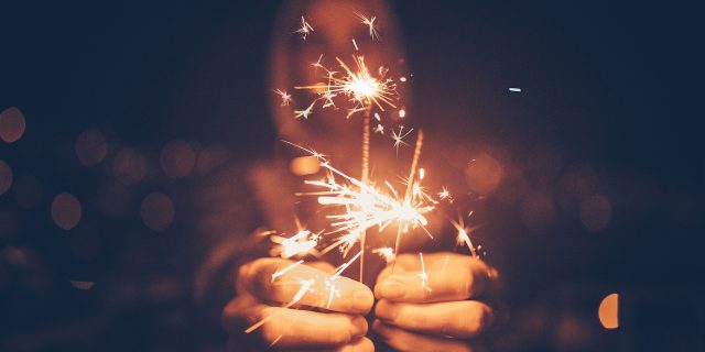 5 Resolutions to Bust Mental Health Stigma in 2018 Woman holding sparklers
