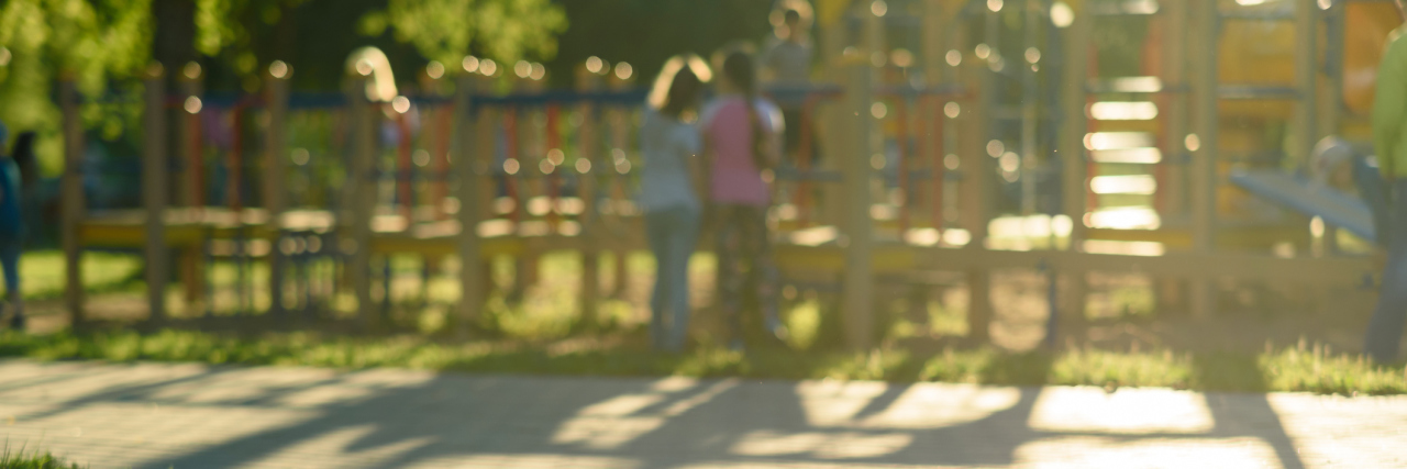 To the Mom at the Park Whose Child Said 'My Dad Hit Me' Defocused and blurred image for background children's playground public park