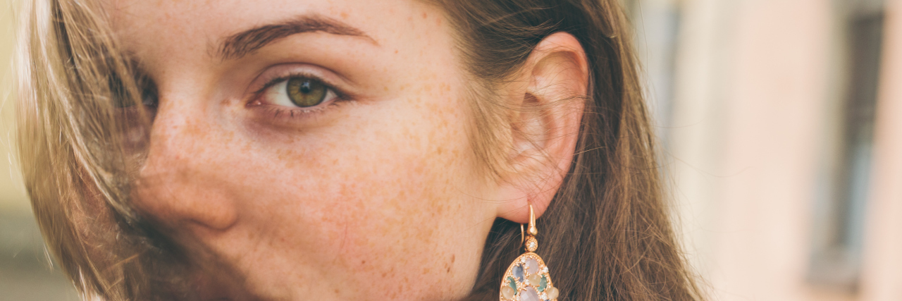 Being Diagnosed With Arthritis as a Teenager close-up photo of a teenager with hair blowing in front of her face