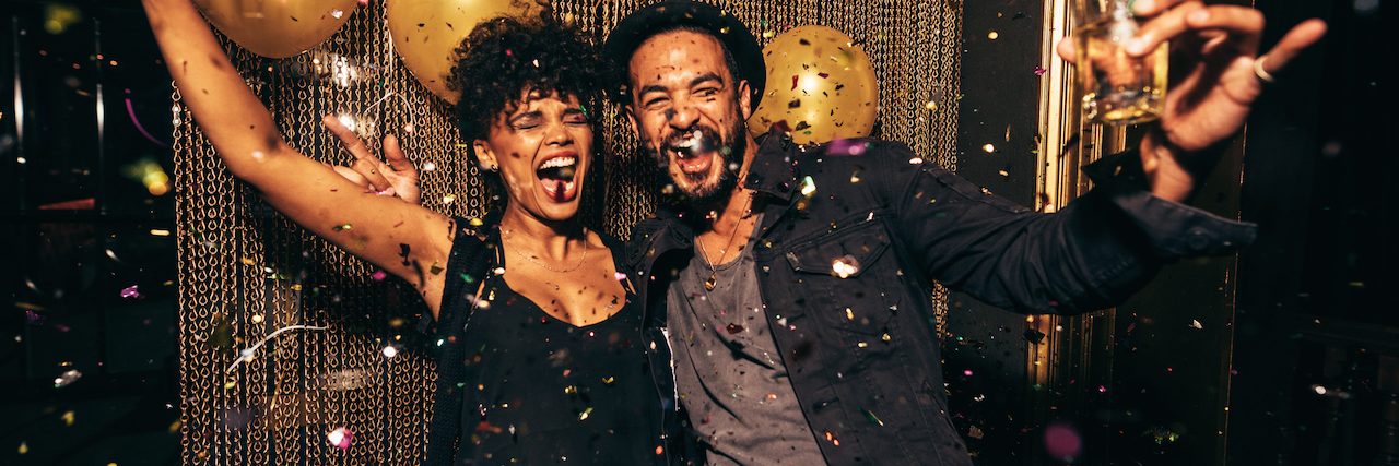 5 Mental Health Goals to Incorporate Into the New Year Two people celebrating New Year's