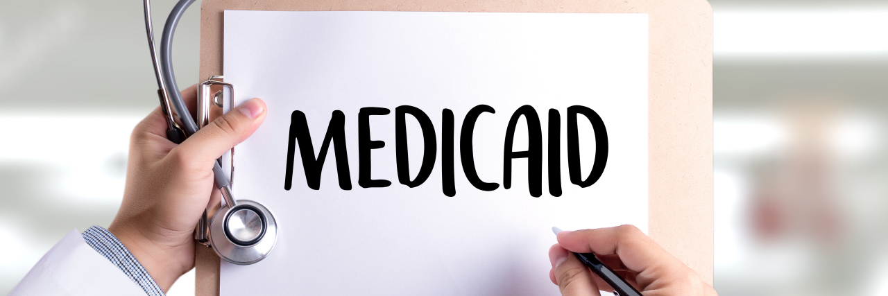 Why Medicaid Is Essential for People With Disabilities Clipboard with paper saying Medicaid and stethoscope.