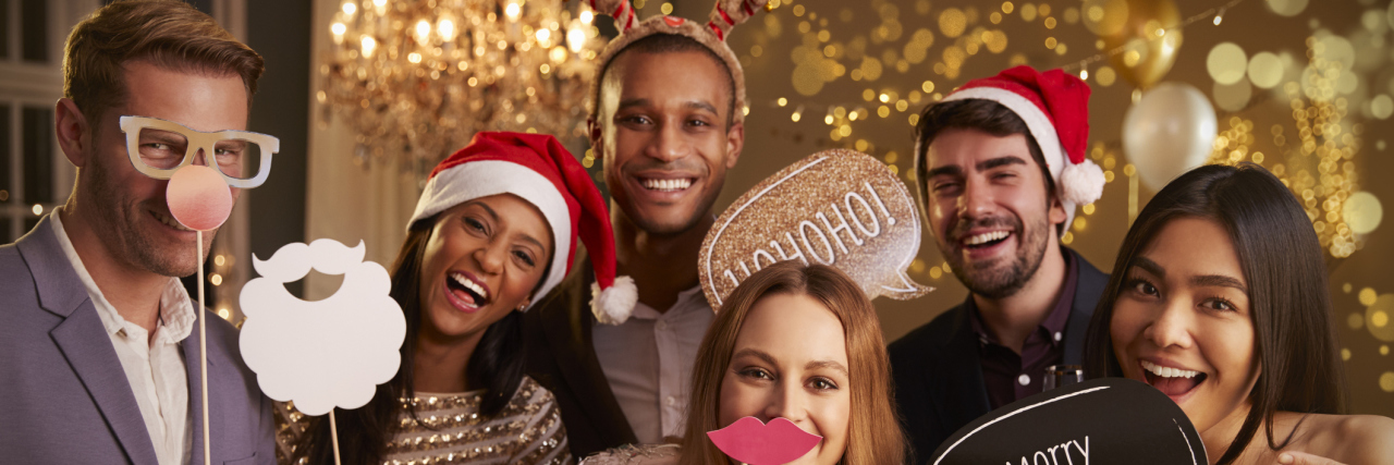 How to Have an Enjoyable Christmas While Chronically Ill A group of friends at a Christmas party.
