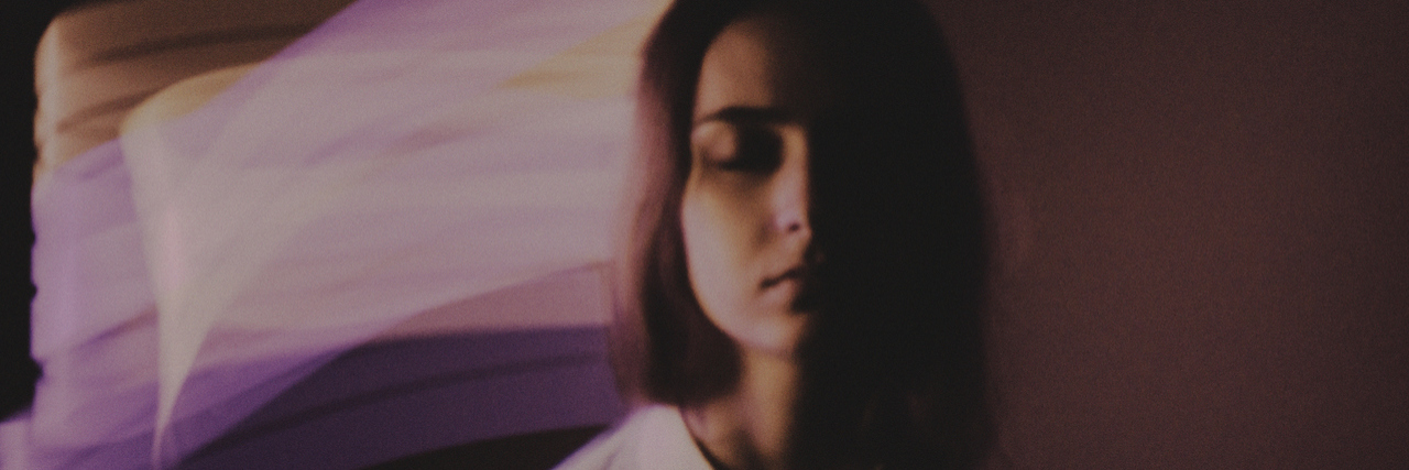 What It's Like Being a Full-Time College Student With Hallucinations woman with blurred background