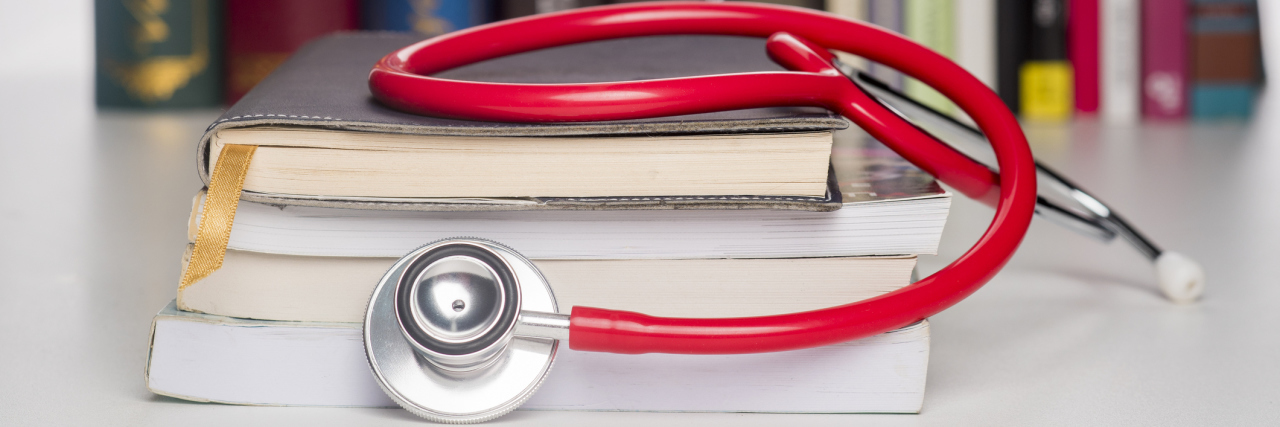 What Medical Students Need to Know About Ehlers-Danlos Syndrome A stethoscope on top of medical books.