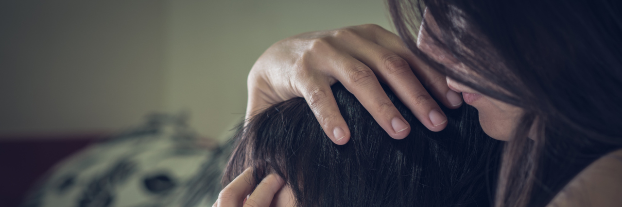 A Letter to My Children About My Dissociative Identity Disorder sad little boy being hugged by mother