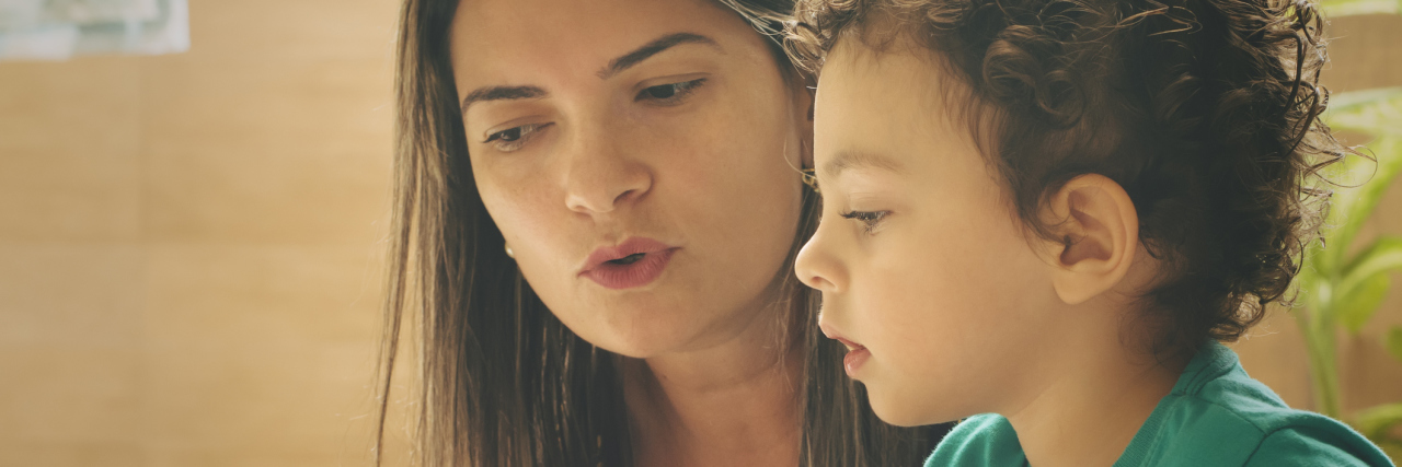 The Responsibility of Parents to Advocate for Children With CHD mother and young son reading a book