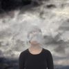 woman with a cloud across her face
