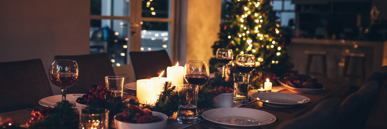 A set table and Christmas tree.