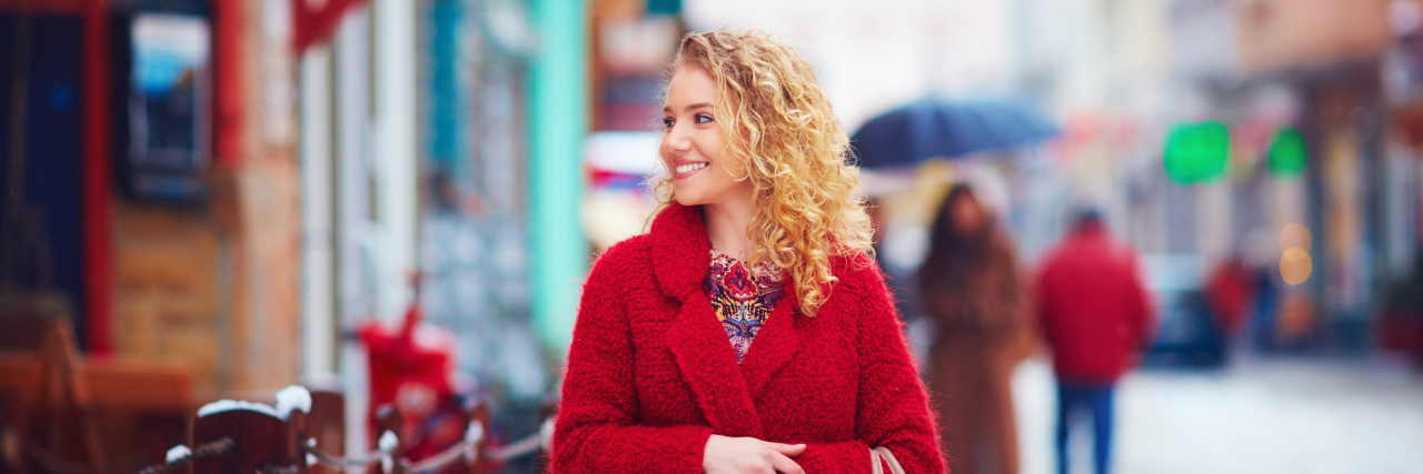 Gift Shopping Tips for Those With Mental Illness, Friends and Family woman smiling in snowy winter street