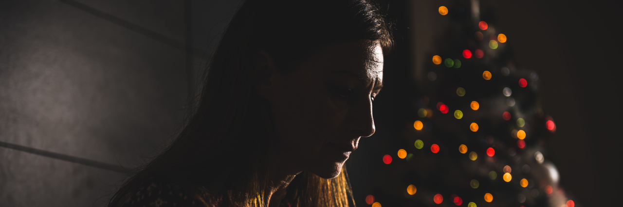 The First Christmas After Losing Both My Parents Lonely women sitting at home during christmas