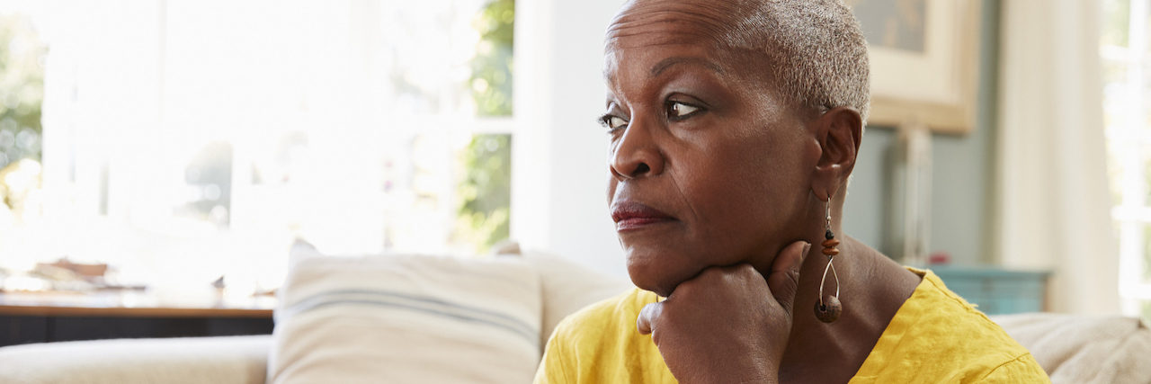 older woman looking sad