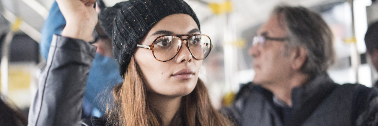 5 Little Tricks That Help Me Get Past Everyday Social Anxieties Young woman in the bus