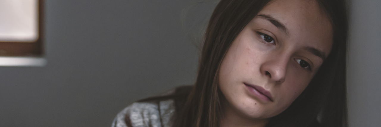 What I Want People Who Ask What My Depression Feels Like to Know Lonely depressed woman feel tired, sad and unhappy. Portrait of a sad teenage girl looking thoughtful about troubles. Emotional portrait of a sad girl. Photo of Expression of lonely female teenager at home