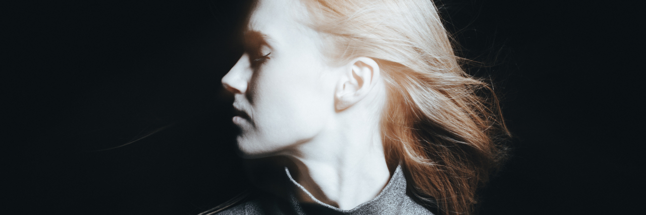 My Anxiety Is a Disorder, Not a Personality Trait Photo of young female in bright light and on dark background