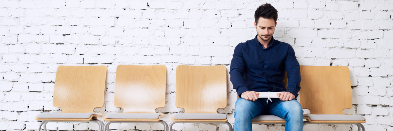 Telling Your New Employer About Your Borderline Personality Disorder anxious young man waiting on job interview wearing jeans