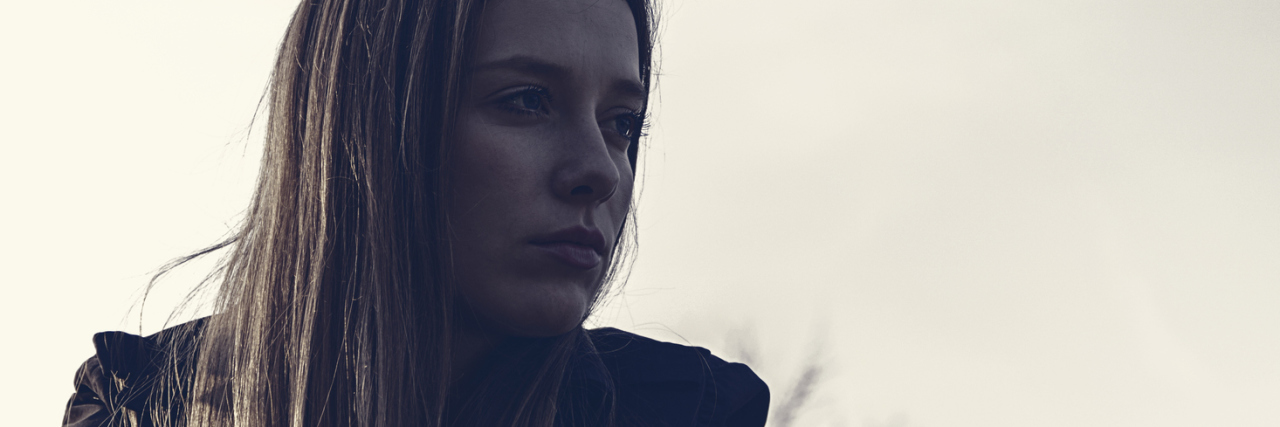 To the Doctors Who Didn't Believe My Borderline Personality Disorder woman alone outdoors upset nearby trees