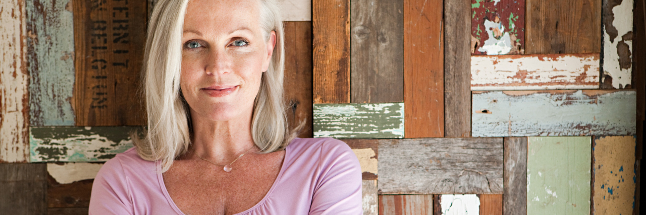 How Developing Asthma and Type 2 Diabetes Has Changed Me woman crossing her arms and smiling