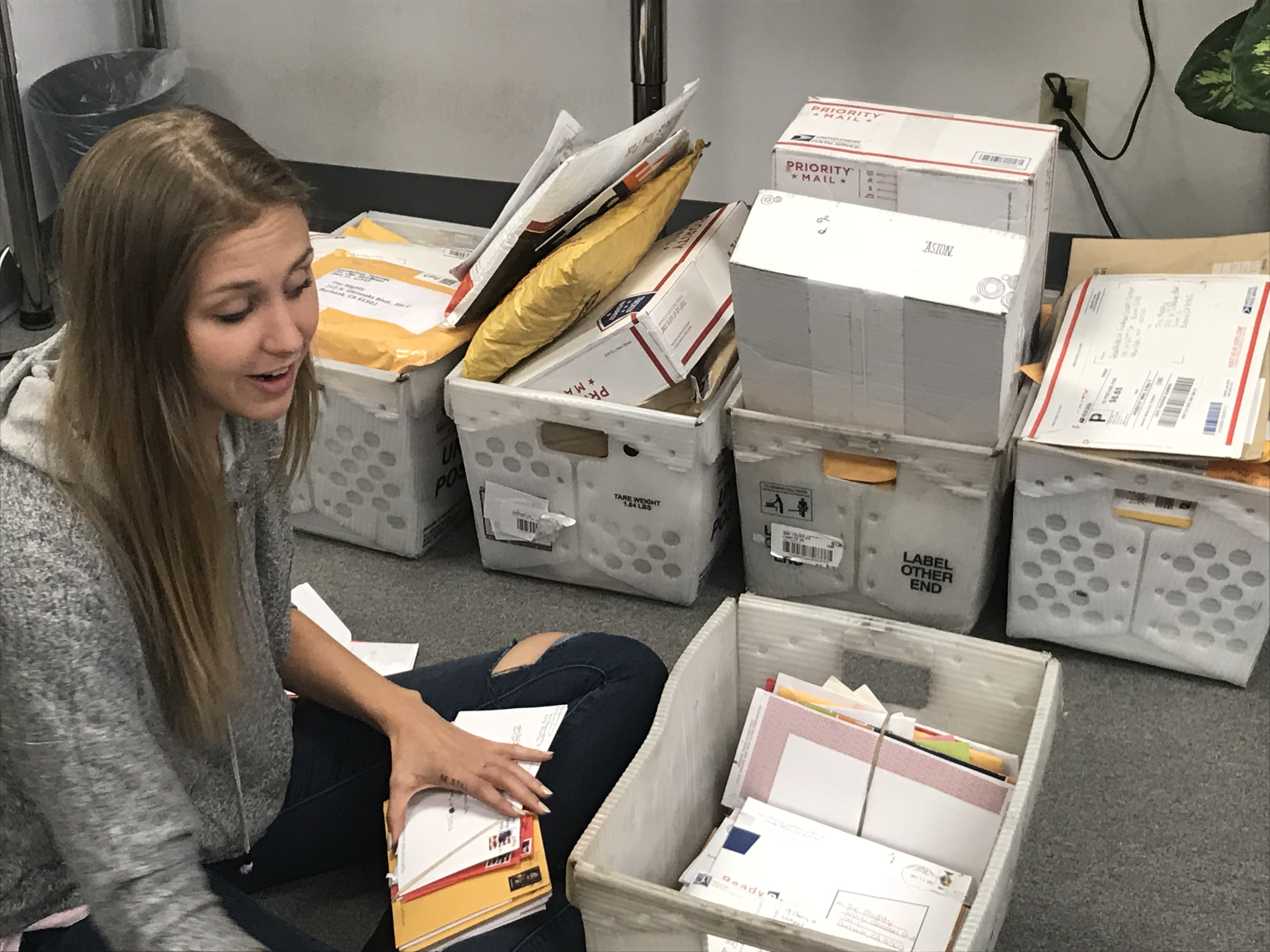 woman opening boxes of cards