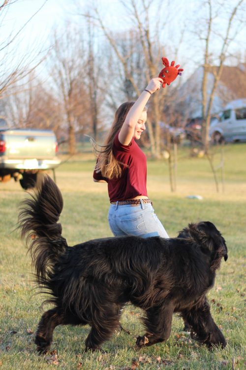 girl outside with her dog