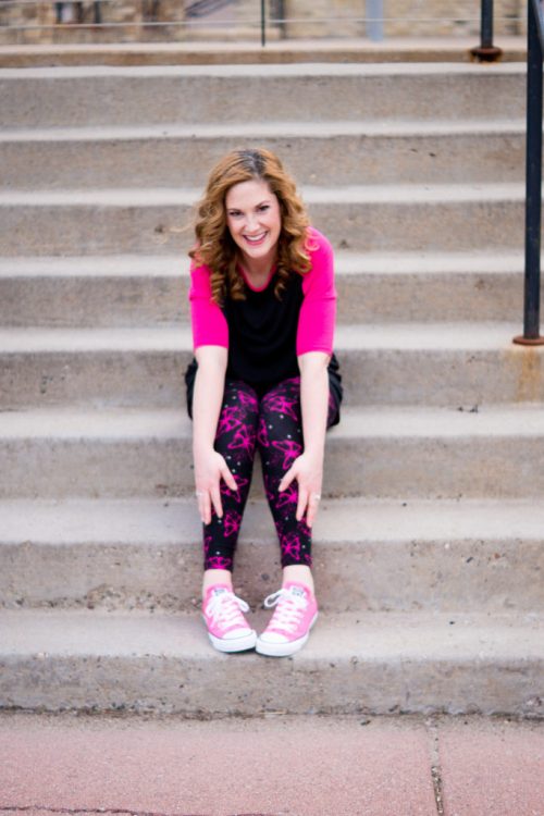 woman smiling and sitting on steps