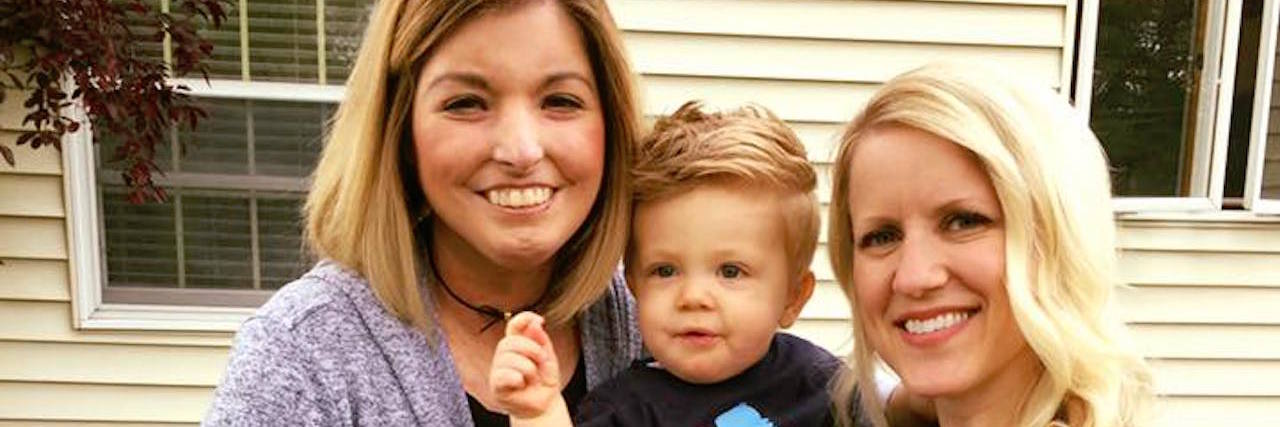 Letting Go of the Past and Living With Scleroderma two women holding a boy on his first birthday