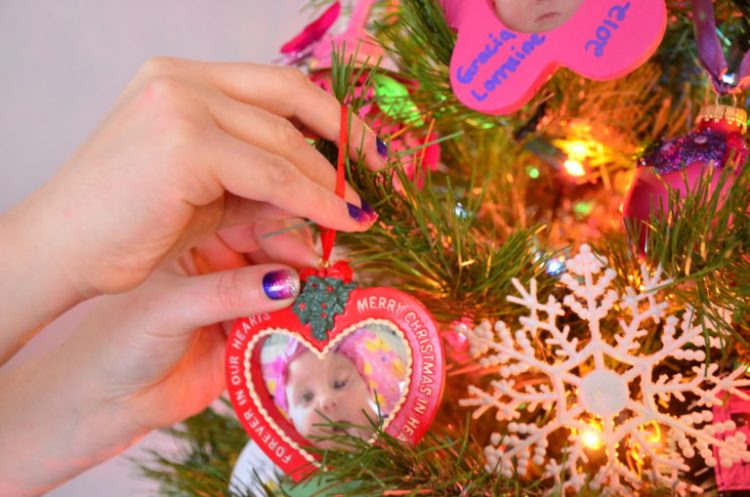 hanging ornament with a picture of a baby on the tree