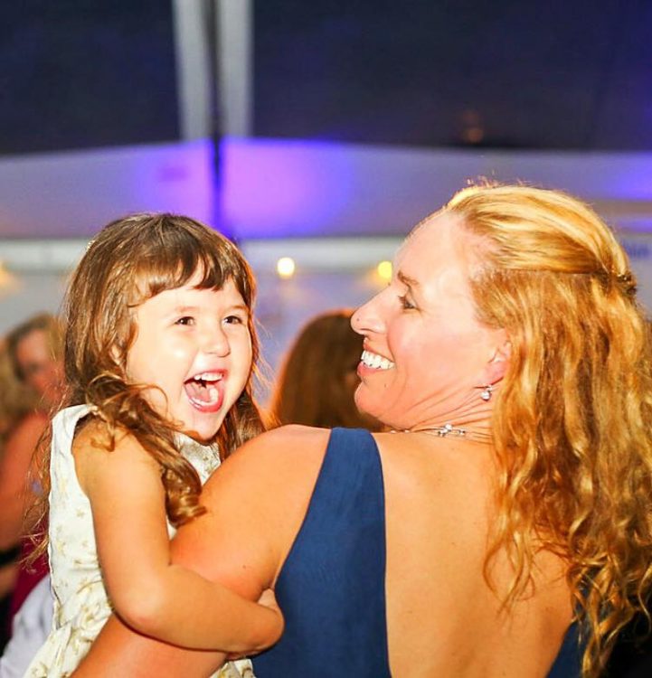 the author and her daughter smiling and dancing