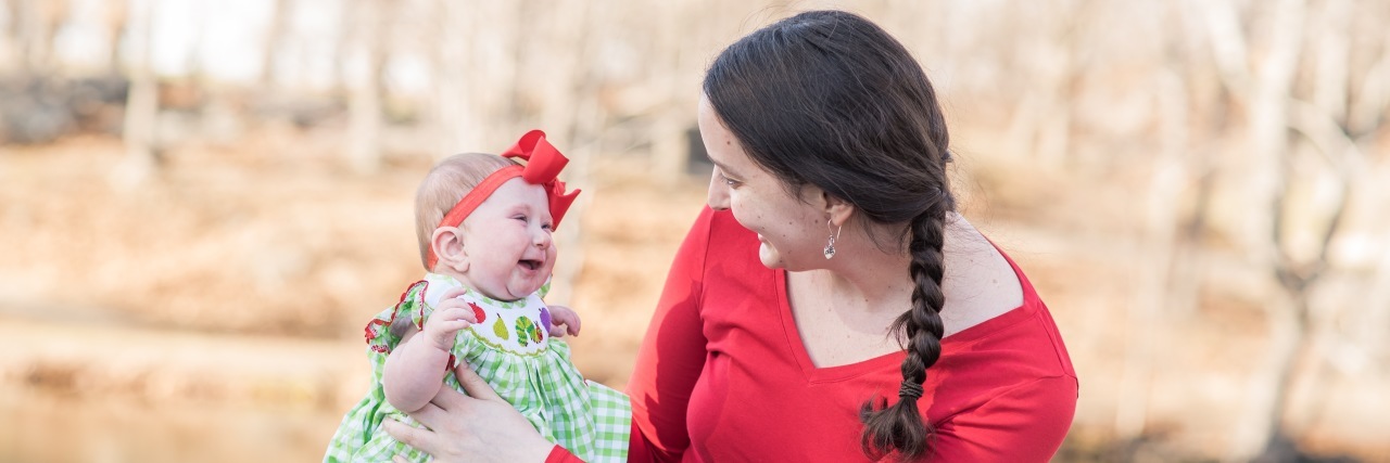 Mother holding baby girl