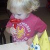 Ryan, little boy with blond hair drinking a Shirley Temple.