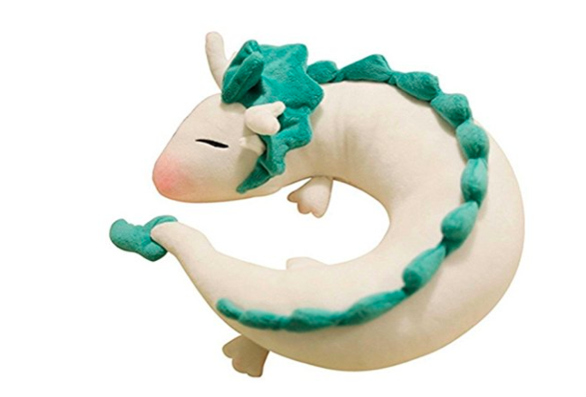 neck pillow that looks like a white dragon with green spikes