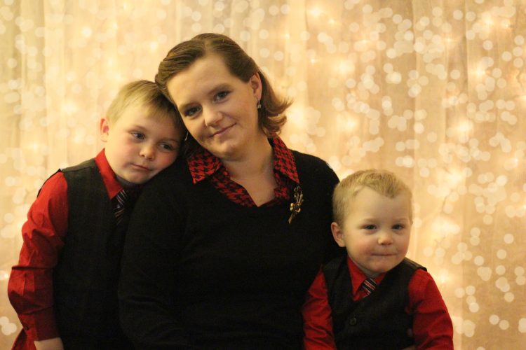 christmas photo of mother and two sons