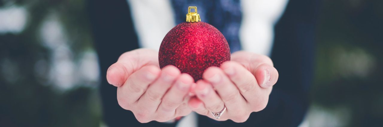 woman holding christmas bauble