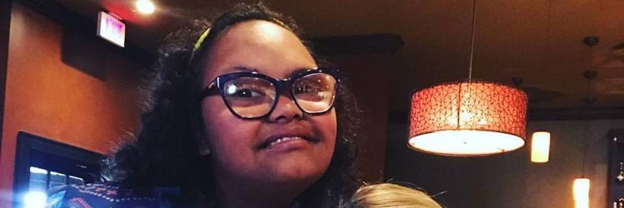 My Daughter With Down Syndrome Told Me I Am Enough D'Andra and friend smiling at camera