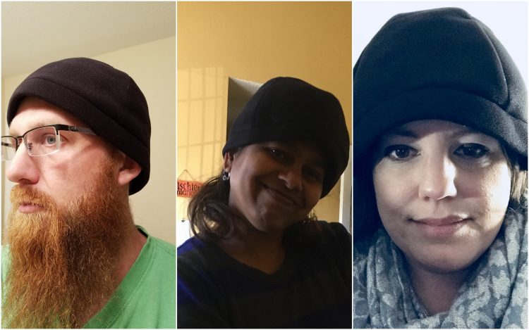 three people wearing the migraine hat