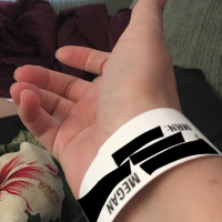 woman wearing hospital bracelet