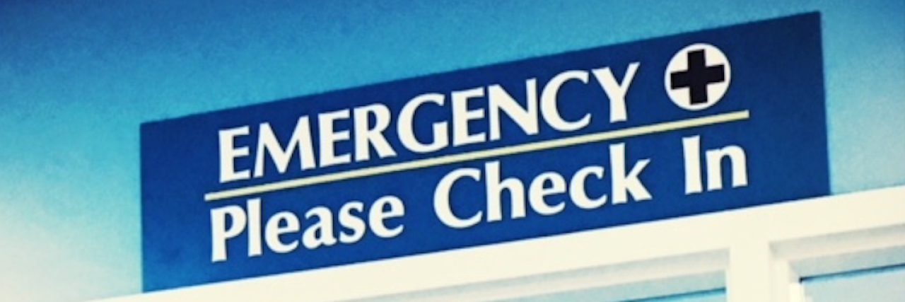 A check-in sign for an emergency room.