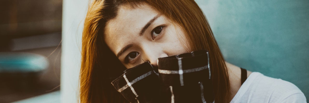 4 Depression Self-Care Tips for When You Literally Cannot woman covering face