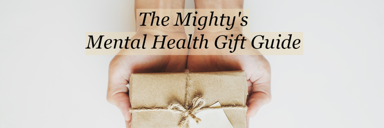 The Mighty's Mental Health Gift Guide Directory A person holding a gift in their hands. Text reads: The Mighty's mental health gift guide
