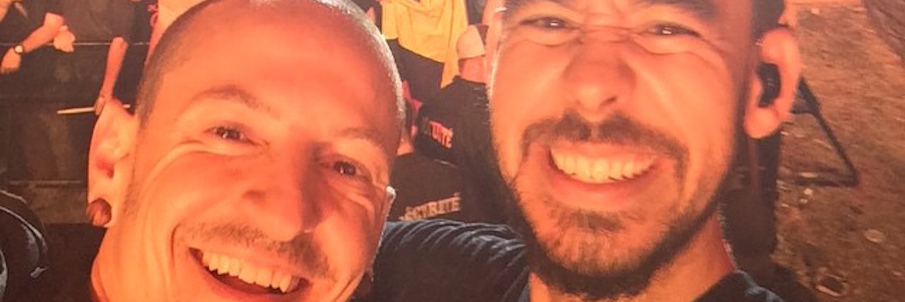 Mike Shinoda Releases 3 New Songs After Chester Bennington's Death Chester Bennington and Mike Shinoda taking a selfie in front of the crowd at a concert.