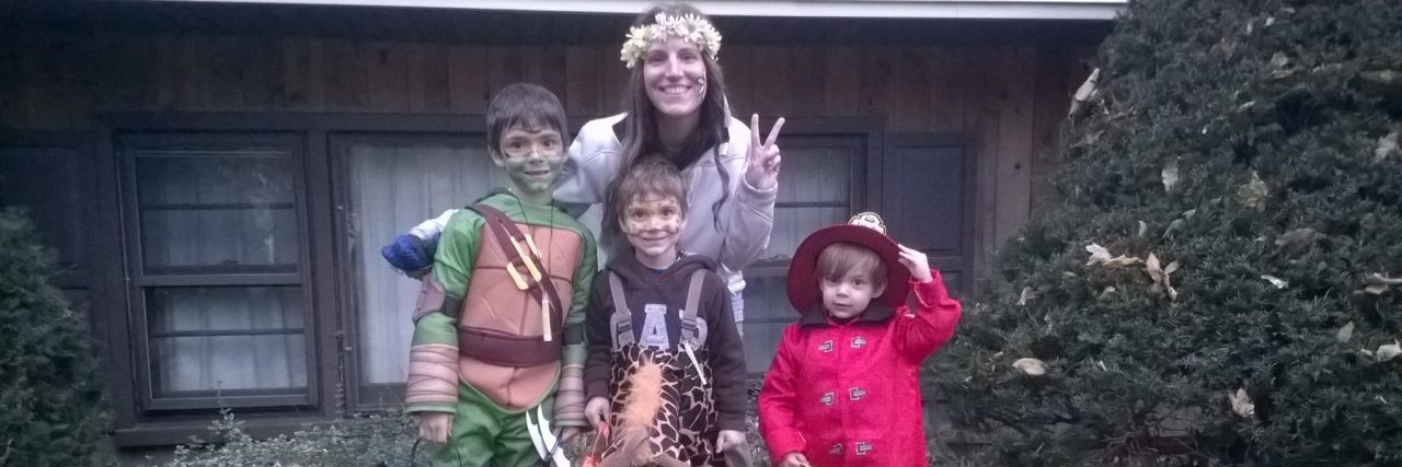 5 Lessons I've Learned From Parenting With a Chronic Illness The writer with her three children on Halloween.