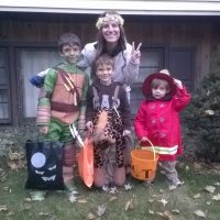 The writer with her three children on Halloween.