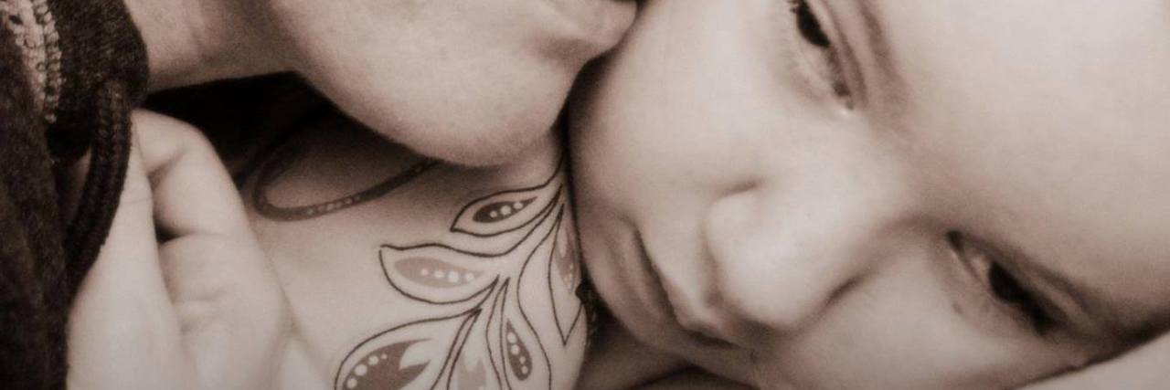 Letter About Grief After Losing Your Child to a Rare Disease The author and her daughter, a close up of their faces