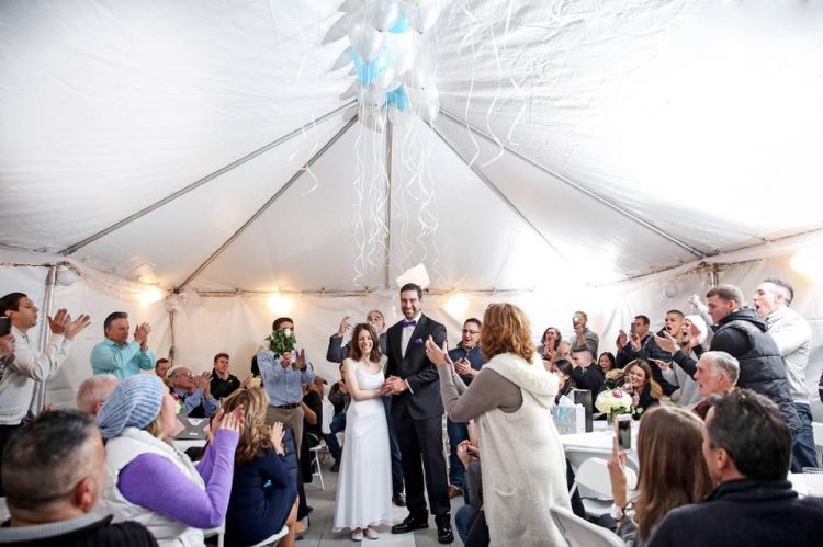 nicole carfagna and danny rios right after getting married, in the tent