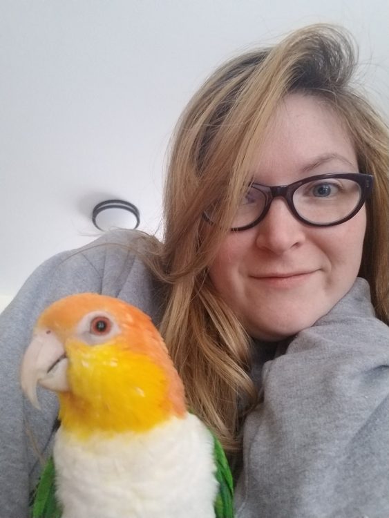 woman with colorful bird