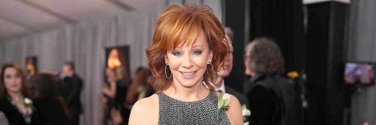 reba mcentire at the grammys wearing a white rose