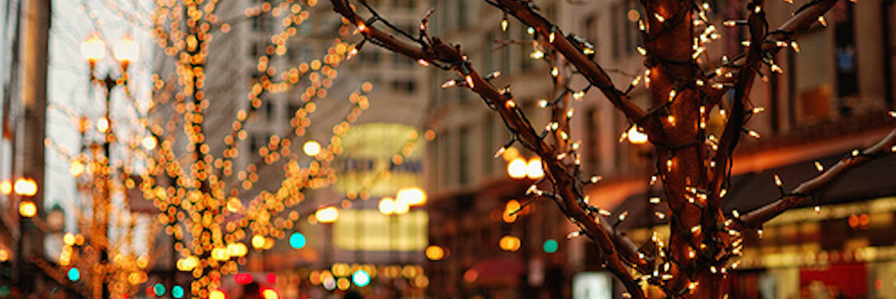 Having Difficult Conversations Over the Holidays About Lyme Disease christmas lights on trees in the city