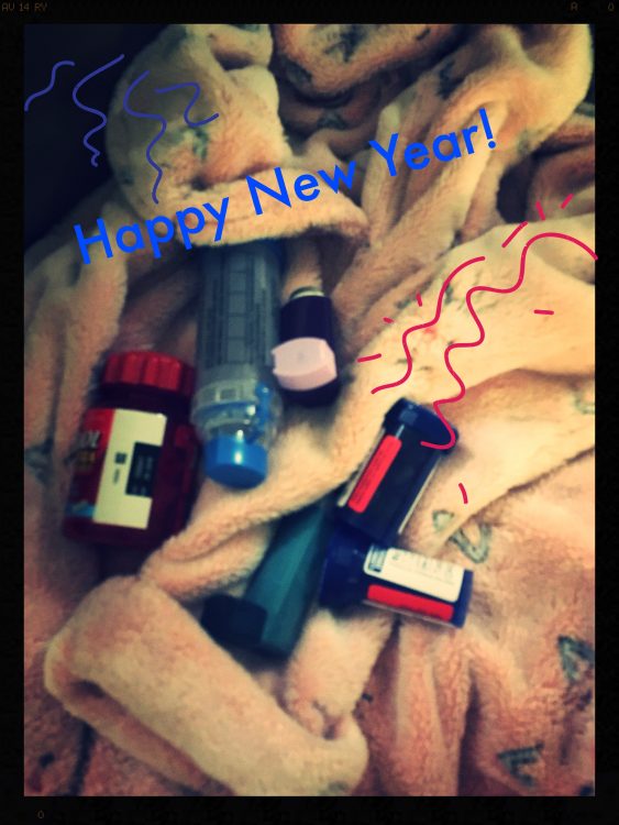 blanket covered with pill bottles and text saying 'happy new year!'