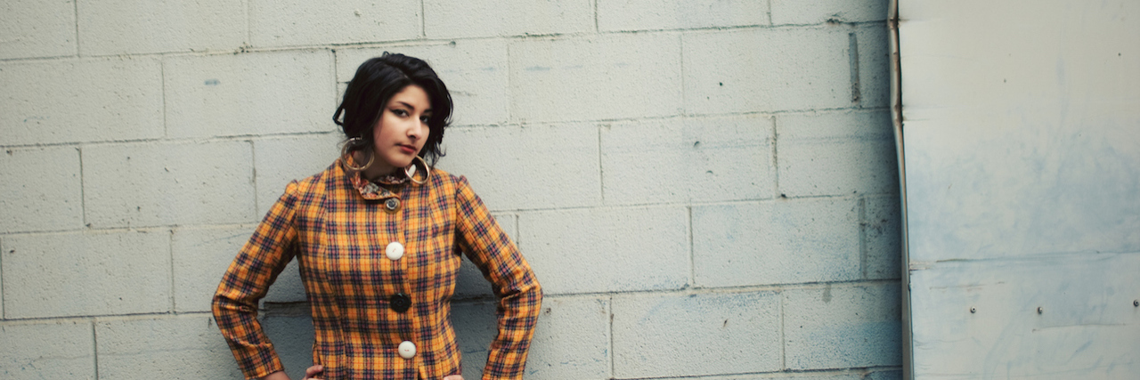 Who My Anxiety Makes Me A woman standing in front of a building