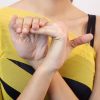 woman bending her fingers back to a 45 degree angle